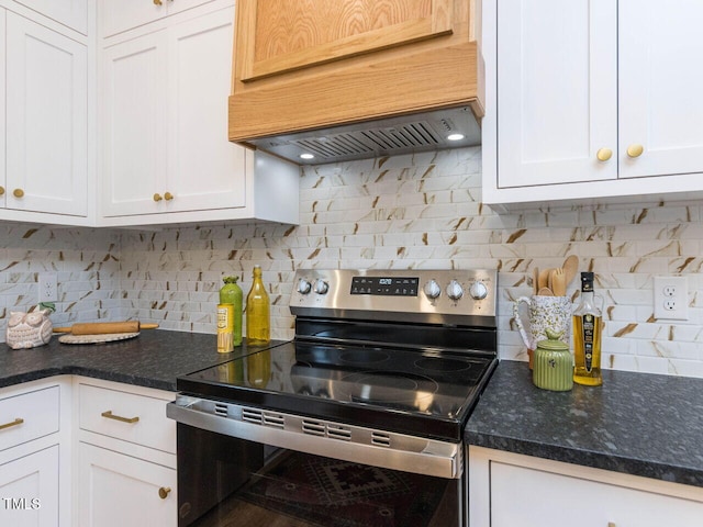 kitchen featuring electric range, custom exhaust hood, decorative backsplash, and white cabinets