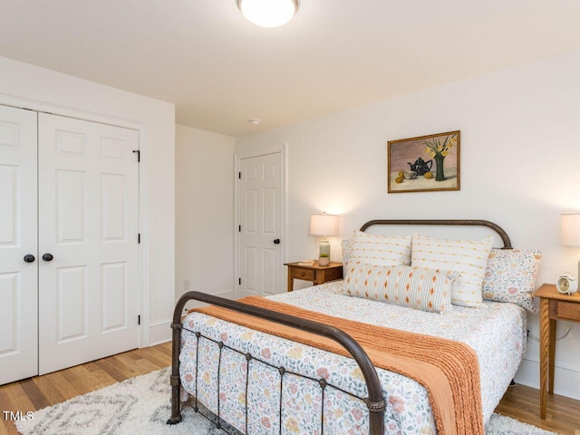 bedroom with a closet and light wood-type flooring