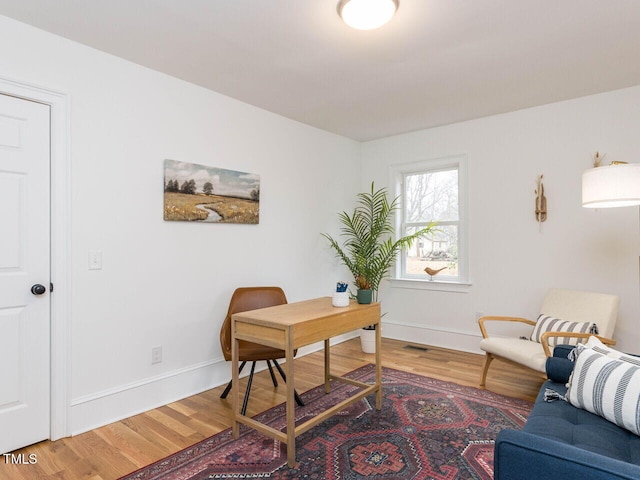 office space with hardwood / wood-style floors