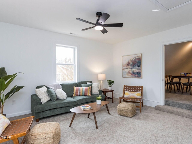 living room featuring carpet floors and ceiling fan