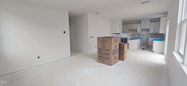 kitchen with white cabinetry and a kitchen island