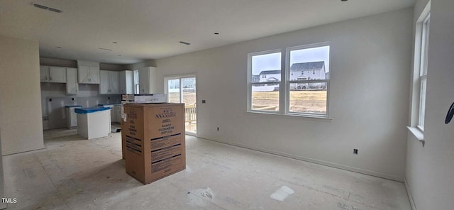 kitchen featuring white cabinetry and a kitchen island