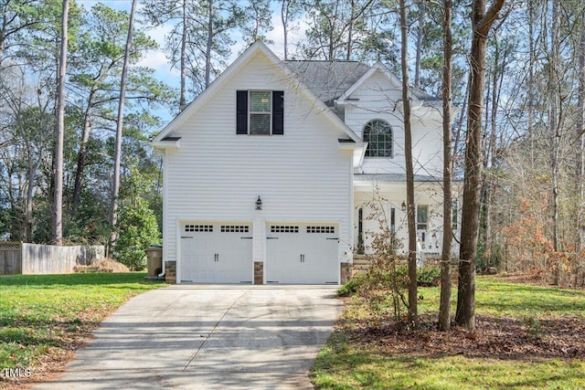 view of side of home with a yard and a garage