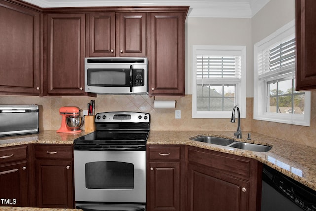 kitchen featuring crown molding, appliances with stainless steel finishes, sink, and decorative backsplash