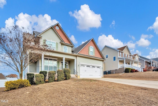 craftsman-style home featuring a garage, a front lawn, and a porch