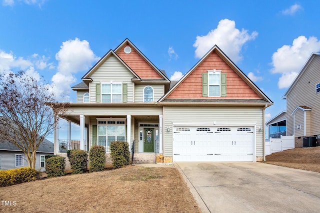 craftsman-style house featuring a porch and a garage