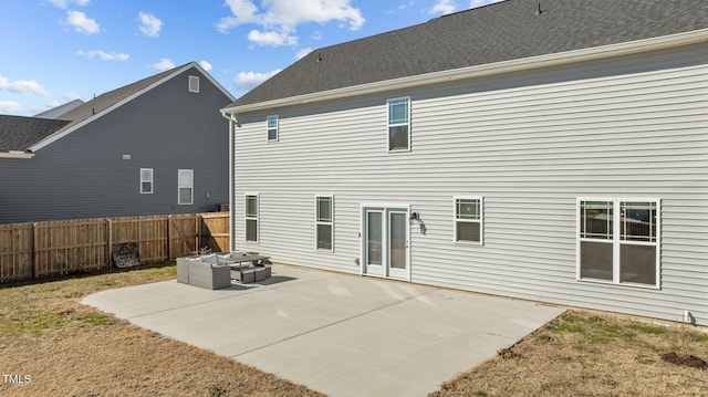 back of house with outdoor lounge area and a patio area