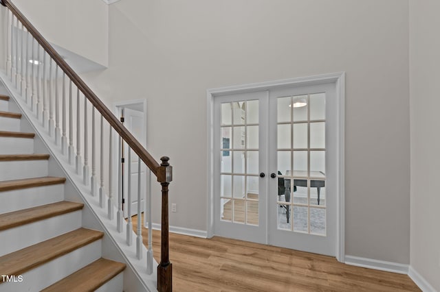 entryway featuring light hardwood / wood-style floors and french doors