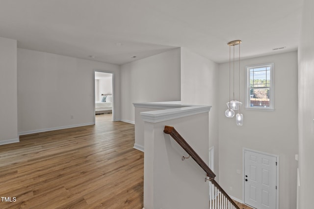 stairway featuring wood-type flooring