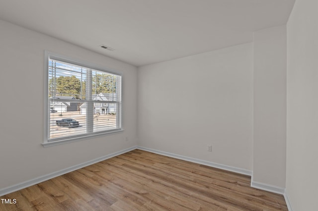 unfurnished room featuring light wood-type flooring