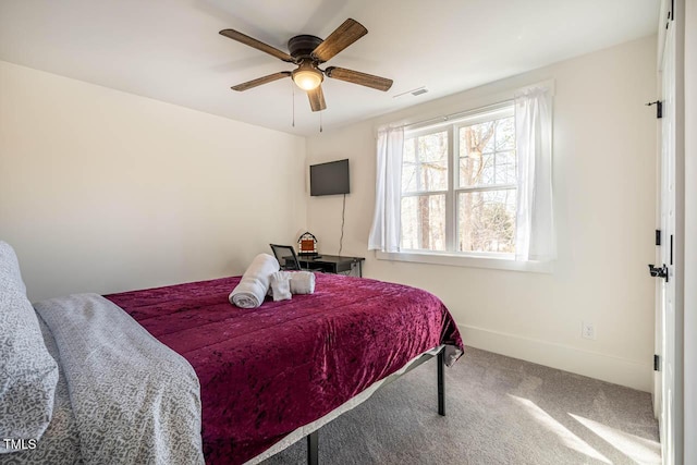 carpeted bedroom featuring ceiling fan