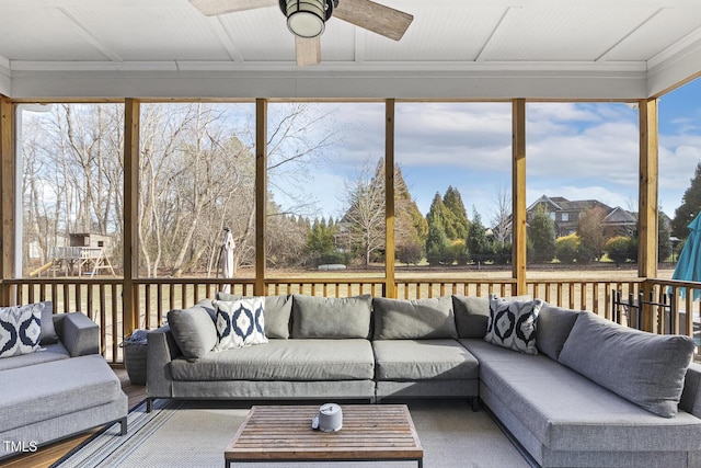 sunroom featuring ceiling fan and a healthy amount of sunlight