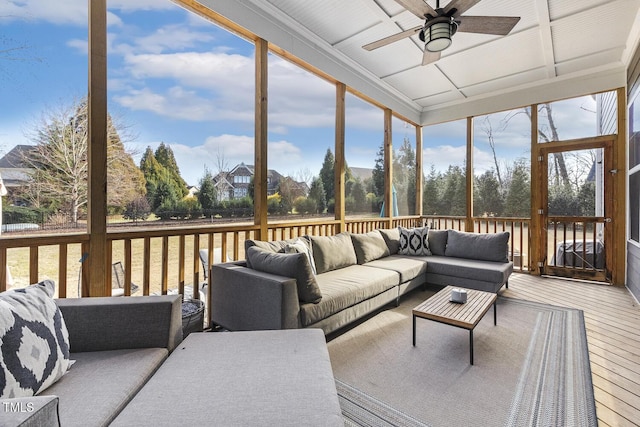 sunroom featuring a healthy amount of sunlight and ceiling fan