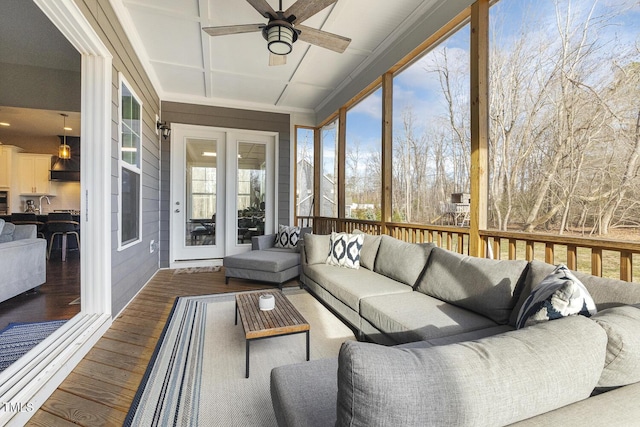 sunroom / solarium with sink and ceiling fan