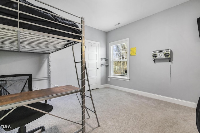 bedroom with light colored carpet