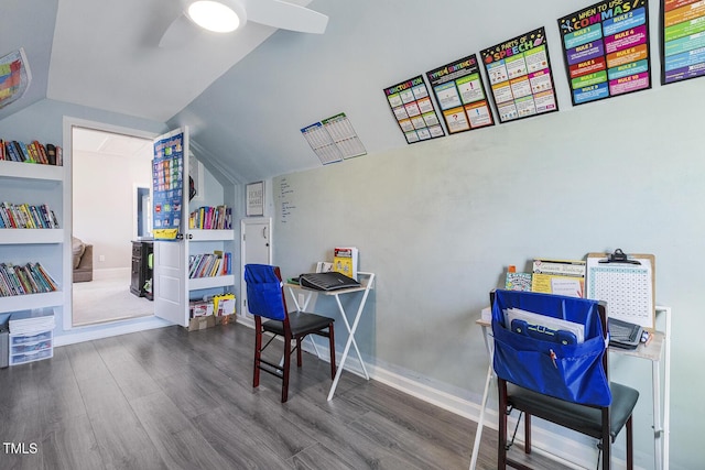 recreation room featuring vaulted ceiling, dark hardwood / wood-style floors, and ceiling fan