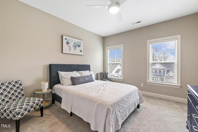 bedroom with light colored carpet and ceiling fan