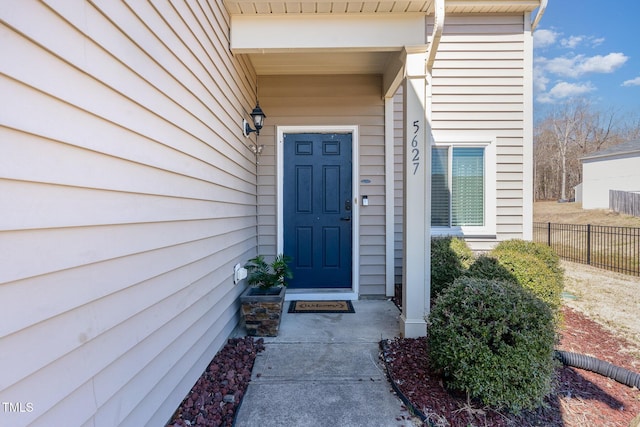 property entrance featuring fence