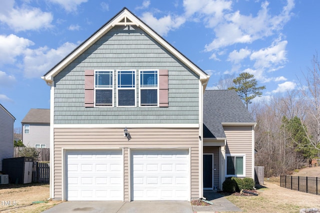 view of front facade featuring concrete driveway, roof with shingles, an attached garage, and fence