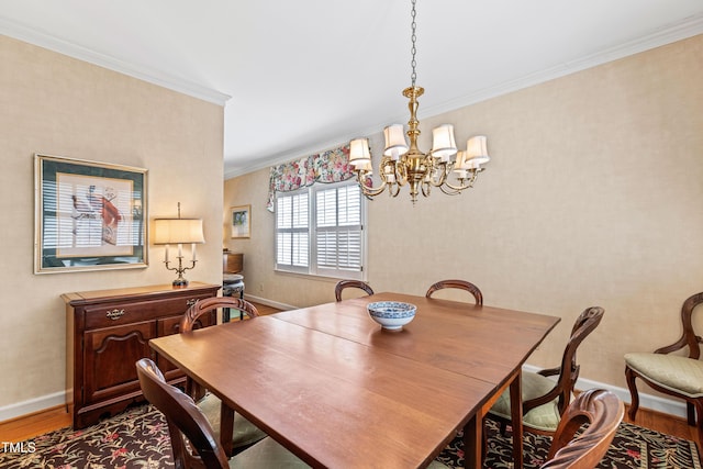 dining room featuring an inviting chandelier, hardwood / wood-style floors, and ornamental molding