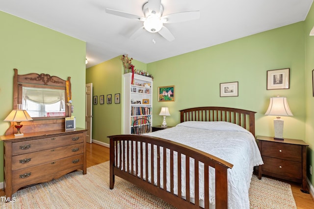 bedroom featuring light hardwood / wood-style floors and ceiling fan