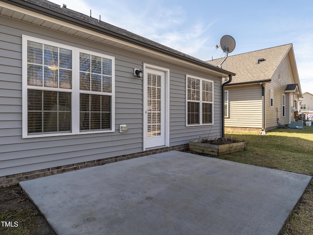 rear view of house with a yard and a patio area