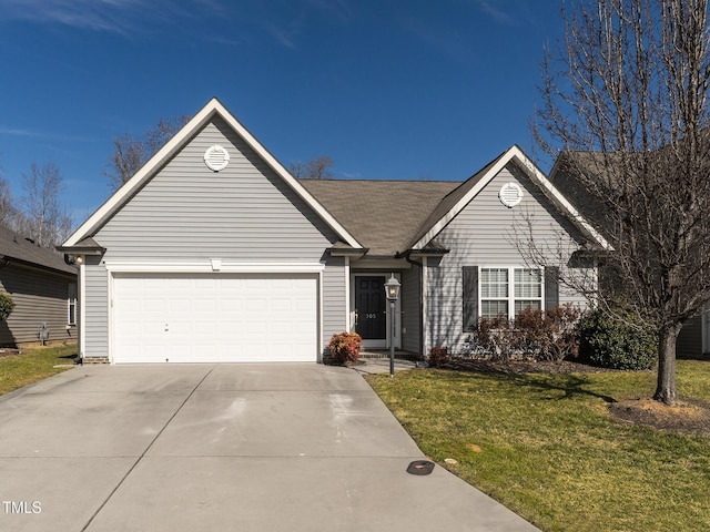 single story home with a garage and a front lawn