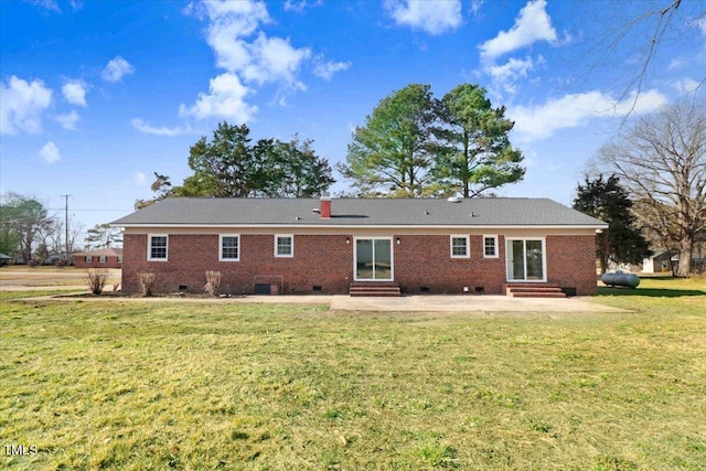 back of house with a patio and a yard