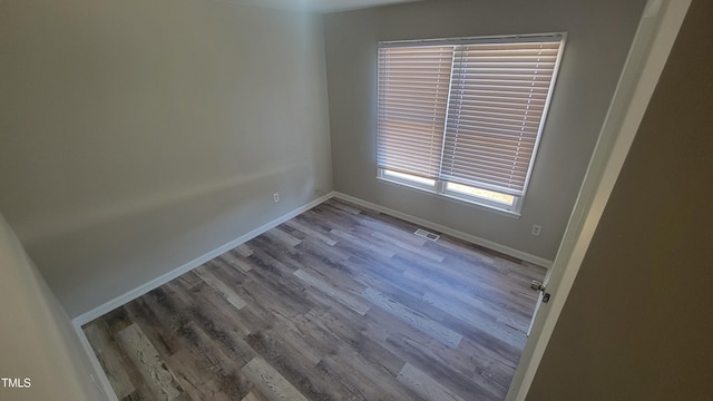 empty room featuring hardwood / wood-style floors