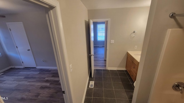 bathroom featuring vanity and wood-type flooring