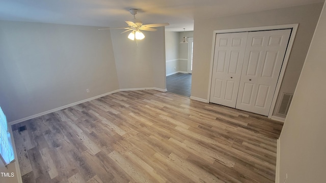 empty room featuring light hardwood / wood-style flooring and ceiling fan