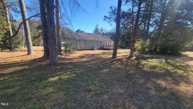 view of yard featuring a wooden deck