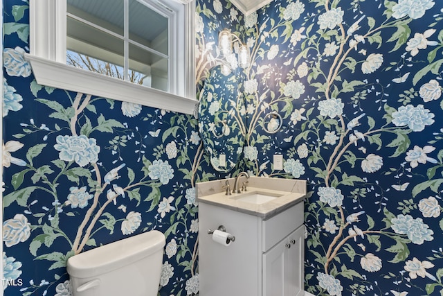 bathroom with vanity and toilet