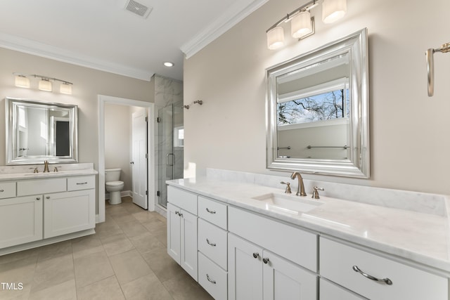 bathroom featuring crown molding, a shower with door, tile patterned flooring, vanity, and toilet