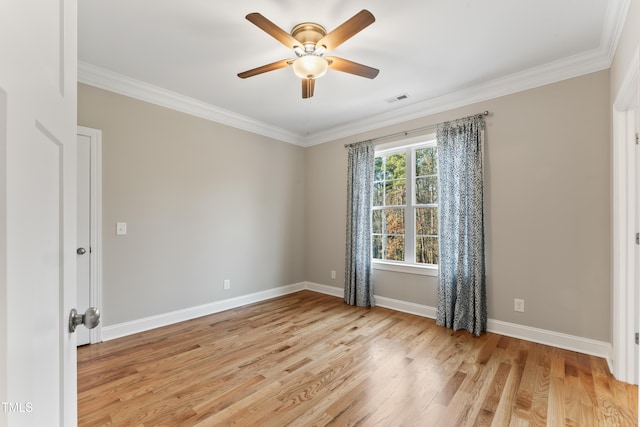 spare room featuring crown molding, ceiling fan, and light hardwood / wood-style floors