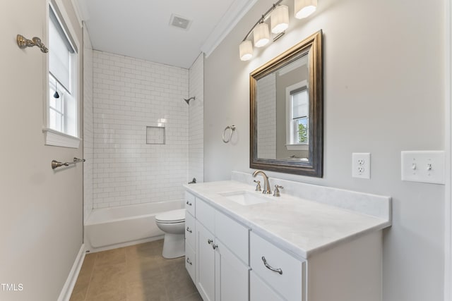 full bathroom featuring tile patterned flooring, vanity, ornamental molding, toilet, and tiled shower / bath