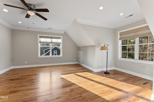 bonus room with hardwood / wood-style flooring and ceiling fan