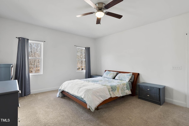 bedroom featuring light colored carpet and ceiling fan