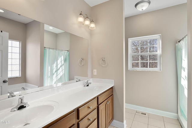 bathroom with vanity, tile patterned floors, and shower with separate bathtub