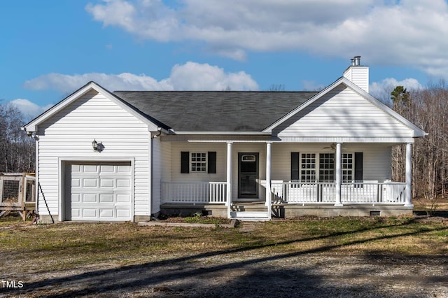 ranch-style home with a garage, a front yard, and covered porch