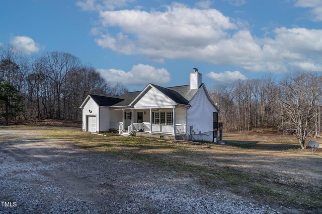 view of front of property with a garage and covered porch