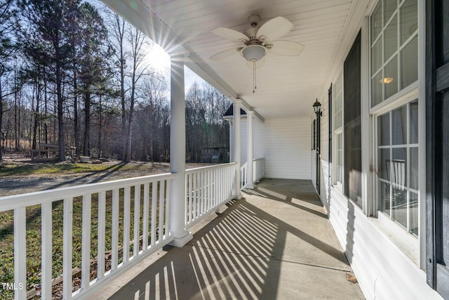 balcony with ceiling fan and covered porch