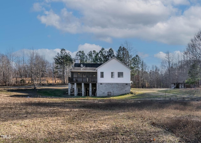 view of property exterior featuring a sunroom