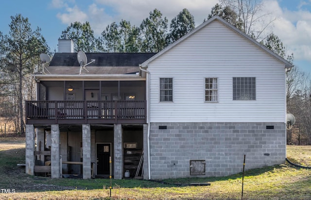 back of house with a sunroom