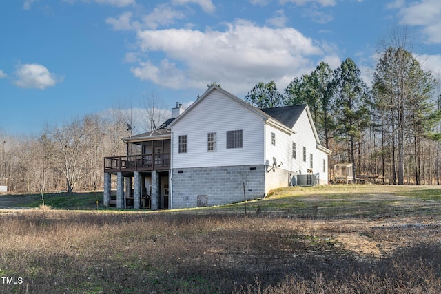 view of home's exterior featuring a deck and a sunroom