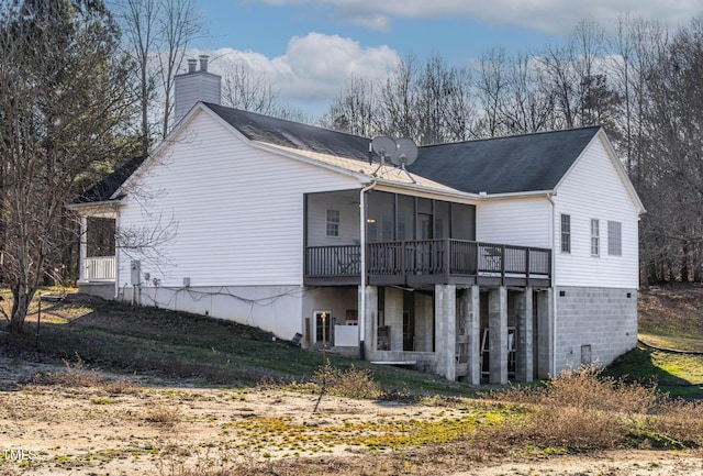 back of house with a sunroom