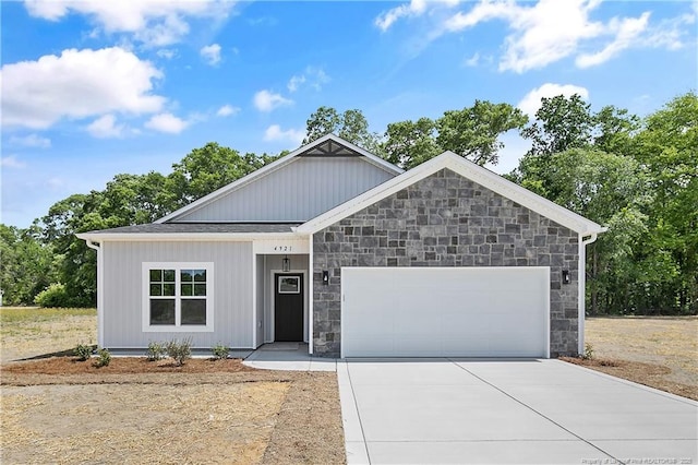 4921 High Branch Ct, Stedman, NC 28391 - view of front of home featuring concrete driveway, an attached garage, and stone siding