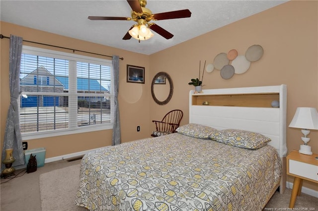 bedroom featuring ceiling fan and carpet flooring