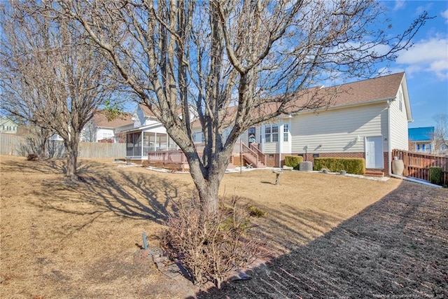 view of yard with a sunroom