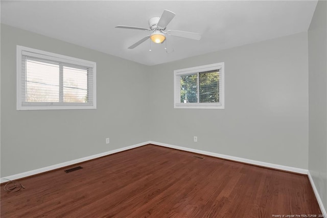 empty room featuring hardwood / wood-style flooring and ceiling fan